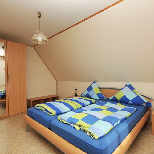 Schlafzimmer in der Ferienwohnung Storchennest