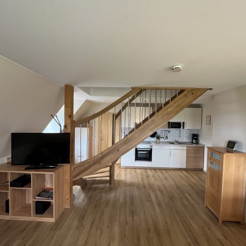 Küche und Wohnzimmer in der Ferienwohnung Storchennest